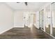 Well-lit bedroom featuring vinyl flooring and mirrored closet doors at 1811 S Quebec Way # 151, Denver, CO 80231