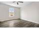 Bright bedroom with vinyl flooring and a large window at 1811 S Quebec Way # 151, Denver, CO 80231