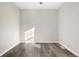 Small bedroom with laminate flooring and a window letting in sunlight at 1811 S Quebec Way # 151, Denver, CO 80231