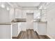Bright white kitchen with granite countertops and ample cabinet space at 1811 S Quebec Way # 151, Denver, CO 80231