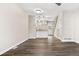 Open living room with vinyl wood flooring and modern light fixtures at 1811 S Quebec Way # 151, Denver, CO 80231