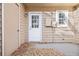 Small back patio with a white door and wooden deck at 1811 S Quebec Way # 151, Denver, CO 80231
