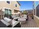 Back deck features outdoor seating, a fire pit table, and views of the surrounding neighborhood at 3011 Low Meadow Blvd, Castle Rock, CO 80109