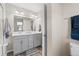 Neutrally designed bathroom with gray vanity and a double sink at 3011 Low Meadow Blvd, Castle Rock, CO 80109
