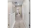 Upstairs hallway with carpeted floors and white trim, leading to the bedrooms and other living areas at 3011 Low Meadow Blvd, Castle Rock, CO 80109