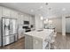 Spacious kitchen with a large island, stainless steel appliances, and adjacent dining area for gatherings at 3011 Low Meadow Blvd, Castle Rock, CO 80109