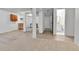 Spacious basement area features wood and carpet flooring, kitchenette, and bathroom access at 2879 S Xanadu Way, Aurora, CO 80014