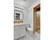 Bathroom with vanity, mirror, toilet, and shower at 2879 S Xanadu Way, Aurora, CO 80014