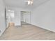 Bedroom featuring a ceiling fan, door, and mirrored closet doors with lots of light at 2879 S Xanadu Way, Aurora, CO 80014