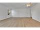 Spacious bedroom with a ceiling fan, light laminate flooring, and a bright window at 2879 S Xanadu Way, Aurora, CO 80014