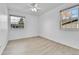 Bright bedroom with two windows providing natural light and a ceiling fan at 2879 S Xanadu Way, Aurora, CO 80014