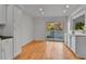 Bright dining room featuring hardwood floors and sliding doors to deck at 2879 S Xanadu Way, Aurora, CO 80014
