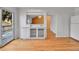Open floorplan shows dining room featuring hardwood floors and kitchen view at 2879 S Xanadu Way, Aurora, CO 80014