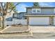Charming townhouse with a two-car garage and lovely stone accents on the facade at 2879 S Xanadu Way, Aurora, CO 80014