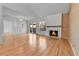 Sun-filled living room boasts hardwood floors and a charming fireplace, perfect for gatherings at 2879 S Xanadu Way, Aurora, CO 80014