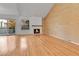 Bright living room with hardwood floors and a fireplace at 2879 S Xanadu Way, Aurora, CO 80014