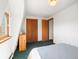Bedroom with closet and doors, featuring an A-frame window with natural light at 456 Copperdale Ln, Golden, CO 80403