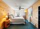 Bedroom with wood paneled walls, carpet, and a window view at 456 Copperdale Ln, Golden, CO 80403