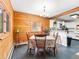 Charming dining area with wood paneling, ample natural light, and a cozy atmosphere for Gathering meals at 456 Copperdale Ln, Golden, CO 80403