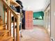 Entryway featuring wooden stairs, terra cotta floors, and access to other rooms at 456 Copperdale Ln, Golden, CO 80403