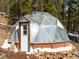 Exterior of the greenhouse features a unique geodesic design with a sturdy wooden base at 456 Copperdale Ln, Golden, CO 80403