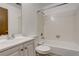 Clean and functional bathroom with white fixtures, a shower-tub combination, and tiled walls at 2335 E Cherrywood Dr, Lafayette, CO 80026