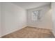 Cozy bedroom with neutral carpet, white walls, and a window that brings in natural light at 2335 E Cherrywood Dr, Lafayette, CO 80026