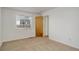 Bedroom featuring neutral carpet, a window, and closet at 2335 E Cherrywood Dr, Lafayette, CO 80026