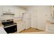 Efficient kitchen features white cabinets, stainless steel appliances, and tile flooring at 2335 E Cherrywood Dr, Lafayette, CO 80026