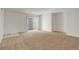 Bright living room featuring neutral carpet, white walls, and sliding doors to the backyard at 2335 E Cherrywood Dr, Lafayette, CO 80026