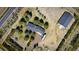 Aerial view of a property with a main house, a large outbuilding, and a long driveway at 12518 N Dixon Dr, Parker, CO 80138