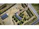 Expansive property featuring a home, additional structure, and mature landscaping, all captured from an aerial perspective at 12518 N Dixon Dr, Parker, CO 80138
