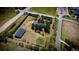 Aerial view of property with mature trees, barn, and a circle driveway at 12518 N Dixon Dr, Parker, CO 80138