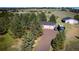 Overhead drone shot shows the house with 2-car garage plus a large barn at 12518 N Dixon Dr, Parker, CO 80138