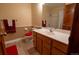Well-maintained bathroom with neutral tones, a classic vanity, and a shower with tub at 12518 N Dixon Dr, Parker, CO 80138