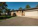 Charming ranch-style home with stone accents, attached garage, and well-manicured lawn at 12518 N Dixon Dr, Parker, CO 80138