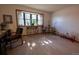 Cozy living room with bay window, carpet floors, and ample natural light at 12518 N Dixon Dr, Parker, CO 80138