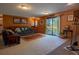 Comfortable living room with sliding glass doors to the deck, plush seating, and a warm, inviting atmosphere at 12518 N Dixon Dr, Parker, CO 80138