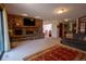 Spacious living room featuring a stone fireplace, large windows, and an open floor plan at 12518 N Dixon Dr, Parker, CO 80138