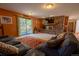 Inviting living room with stone fireplace, outdoor access, and comfortable seating area at 12518 N Dixon Dr, Parker, CO 80138