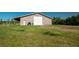 Large outbuilding with gray siding and roof with ample space for storage or workshop at 12518 N Dixon Dr, Parker, CO 80138