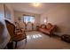 Bright sitting room featuring elegant furniture, carpet, and natural light at 12518 N Dixon Dr, Parker, CO 80138