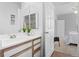 Single vanity bathroom with shower and view of bedroom at 7402 S Quail Cir # 1116, Littleton, CO 80127