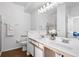 Bathroom with double vanity, large mirror, and shower at 7402 S Quail Cir # 1116, Littleton, CO 80127