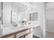 Double vanity bathroom with a view into a bedroom and closet at 7402 S Quail Cir # 1116, Littleton, CO 80127