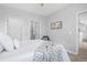 Spacious bedroom with a queen bed and access to a bathroom at 7402 S Quail Cir # 1116, Littleton, CO 80127