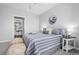Main bedroom with ensuite access and moon wall art at 7402 S Quail Cir # 1116, Littleton, CO 80127