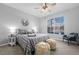 Spacious bedroom with a ceiling fan and large window at 7402 S Quail Cir # 1116, Littleton, CO 80127