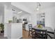 Modern kitchen with white cabinets, stainless steel appliances, and breakfast bar at 7402 S Quail Cir # 1116, Littleton, CO 80127