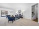 Well-lit living area with modern decor and access to the balcony, offering a harmonious blend of style and comfort at 7402 S Quail Cir # 1116, Littleton, CO 80127